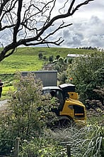 Tiny Towing Solutions use bobcats to help get your house into tight spaces