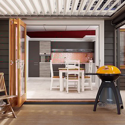 Modern kitchen in Barrett Joinery's Timaru showroom featuring custom cabinetry, bold orange backsplash, and innovative storage solutions, showcasing bespoke joinery for contemporary homes.