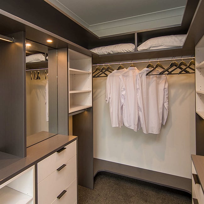 Custom wardrobe solutions with tailored shelving and storage, designed for both walk-in and built-in spaces.