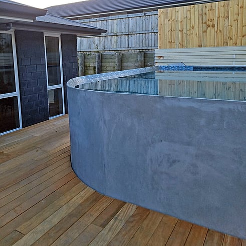 deck surrounding a pool