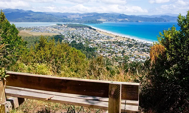 Wooden seat overlooking the community of Matarangi