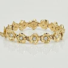Gold and diamond bracelet of flowers