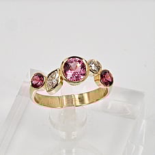 Engagement ring, pink spinels and diamonds