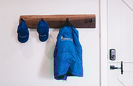 Harrison lane jacket hanging on rustic coat rack