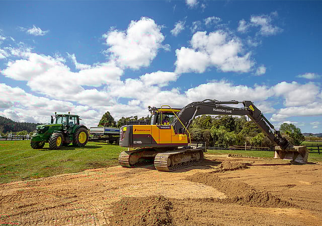 Dark kitchen with metallic pendants
