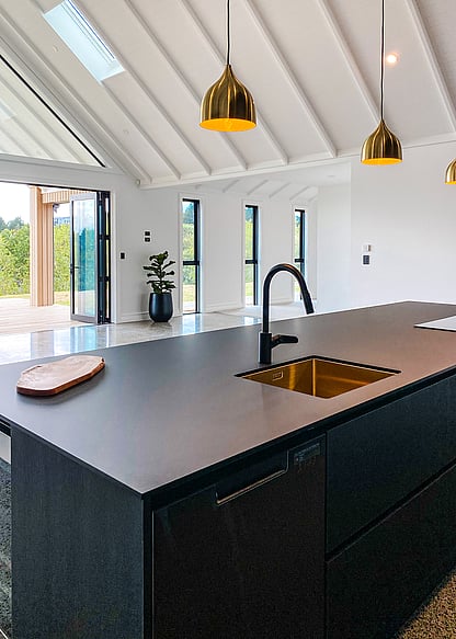 Raked ceiling over living area with decorative rafters