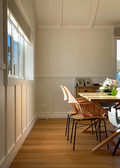 Dark kitchen with metallic pendants