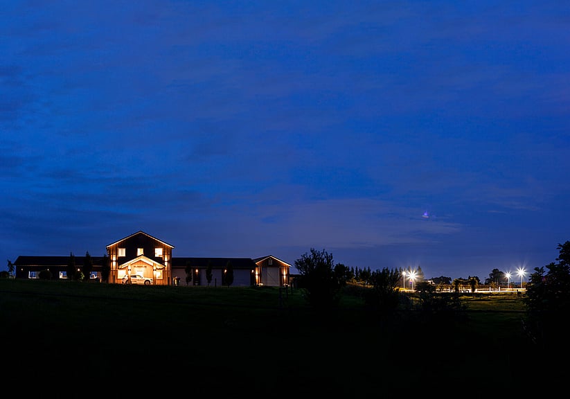Wide view of highgrove barn with horse in the stable