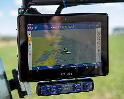 Close-up of a GFX touchscreen display showing an implement behind the tractor