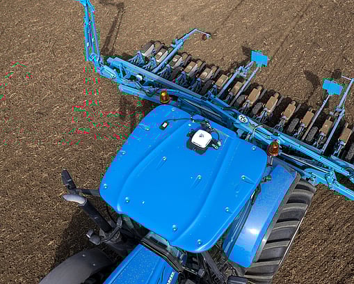 Trimble-powered tractor performing soil tillage, optimising land preparation.