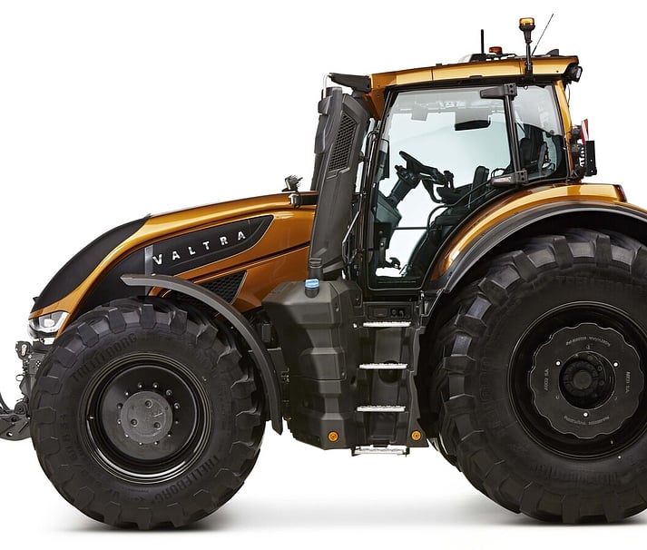 Side profile of the Valtra S Series tractor in signature metallic bronze with large front and rear tyres, showcasing its powerful stance and sleek Scandinavian design.