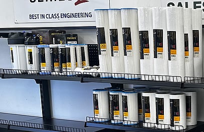 A shelf with a selection of water filters on it