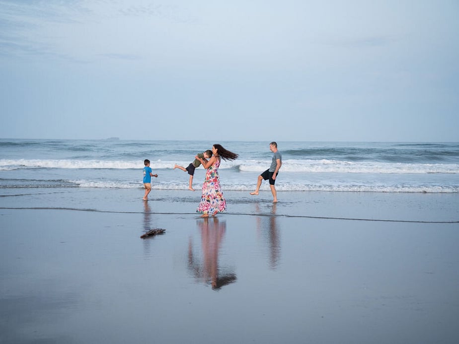 Family fun on beach.  Reflection shot.  Tauranga Photographer.  Tauranga Family Photographer.  Papamoa Family Photographer.  Family.  Bay of Plenty Photographer.