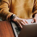 Twoticks recruiter typing on computer