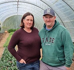Jarrod and Michelle Busby standing in the market garden