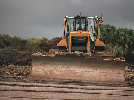 A stock image of a bulldozer in mud