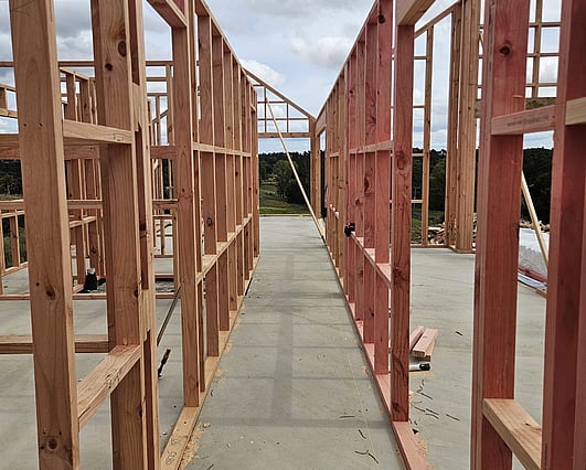 Framing stage at house build showing view from master suite