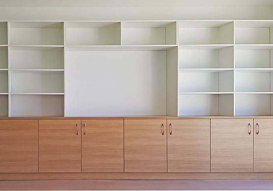 entertainment units with white melamine shelving.