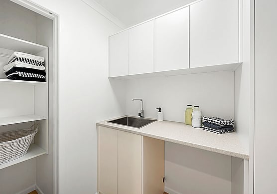 Fitted Laundry Cupboards in White.