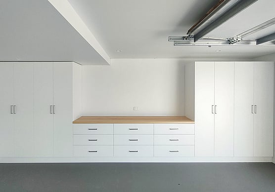 Custom garage cupboards in white.