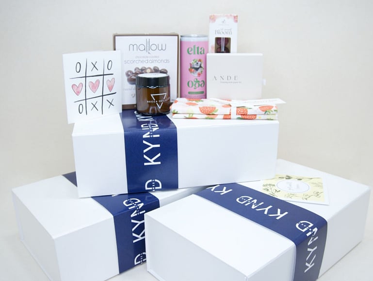 set of kynd gift boxes stacked on top of each other