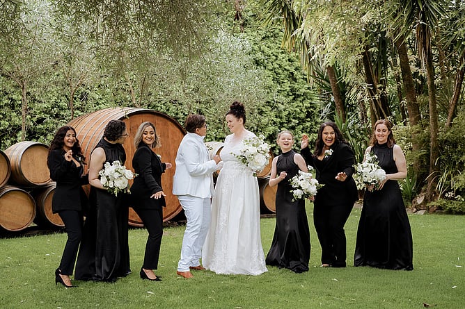 Same-sex wedding couple in bridal party photo at Markovina Estate
