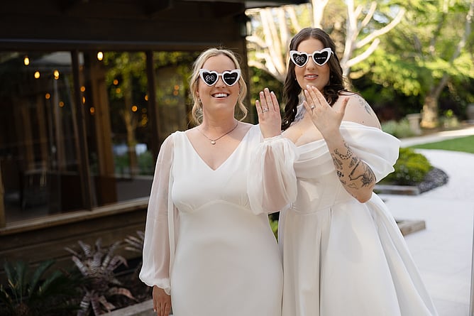Same sex couple enjoying their wedding reception at Markovina Estate in Kumeu Auckland