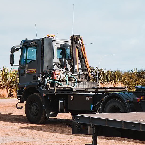 TDM Transport staff member moving modular homes in Hamilton, New Zealand