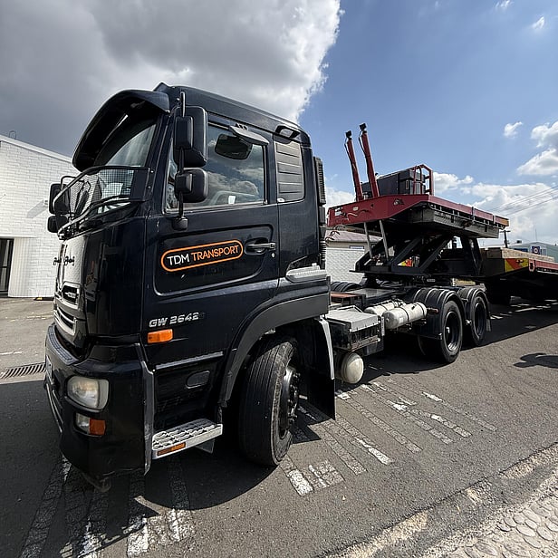 TDM Transport staff member moving modular homes in Hamilton, New Zealand