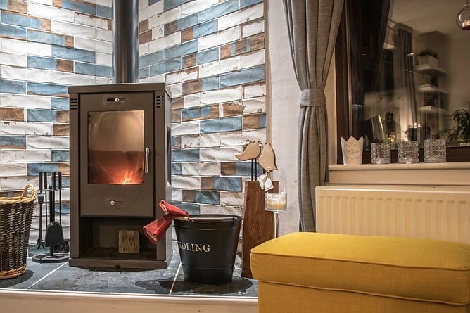 modern woodburner with chimney going through roof