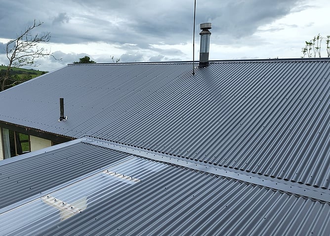 new roof by Flood Roofing with Chimney