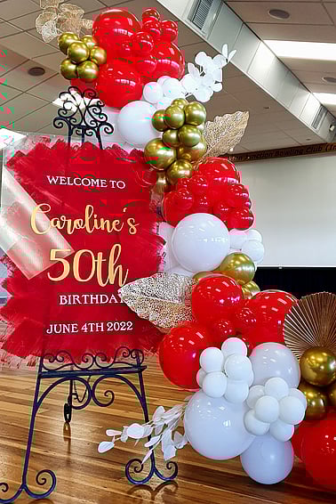 Birthday welcome signage and balloon garland
