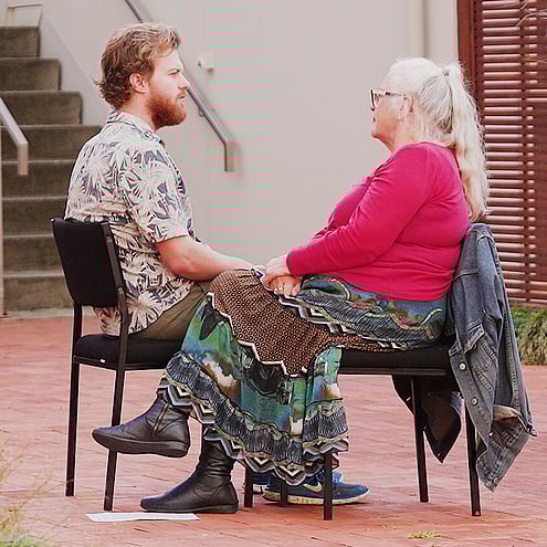 Two people talking in Somatic Compassion seating arrangement