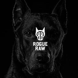 Rogue Raw logo overlaid on an image of a Doberman
