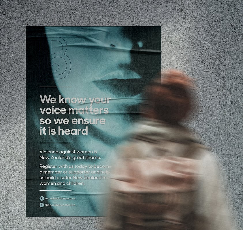 Poster on wall with a womans mouth. Reads 'We know your voice matters so we ensure it is heard"