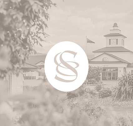 White monogram on image of The George, Speldhurst estate