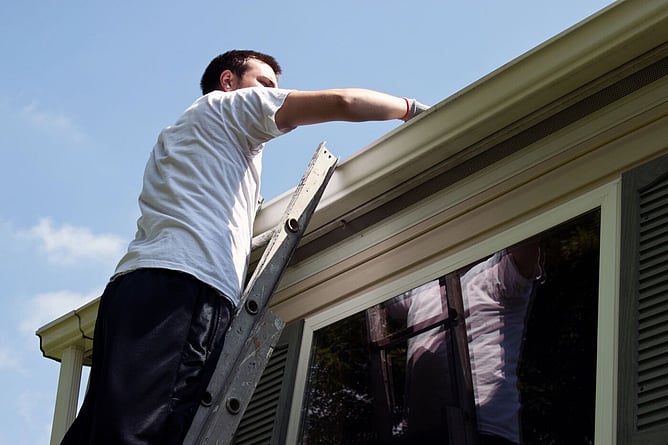 Man checking gutters