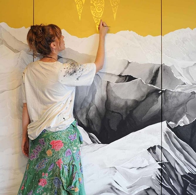 Sofia Minson in her New Zealand studio working on a large scale original painting, Māori-inspired contemporary art