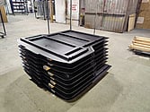 Photo of 12 out of 20 black powder coated skip bins