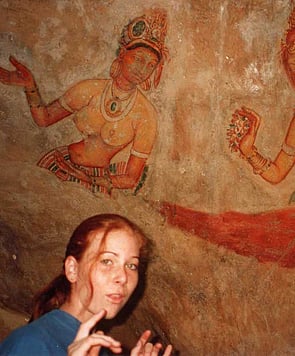 Sofia Minson with cave paintings in Sri Lanka