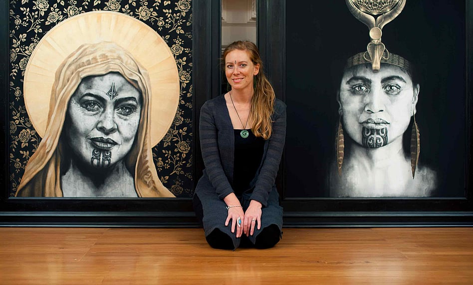 Artist Sofia Minson with her paintings "Rose of the Cross" and "Queen of Raa"