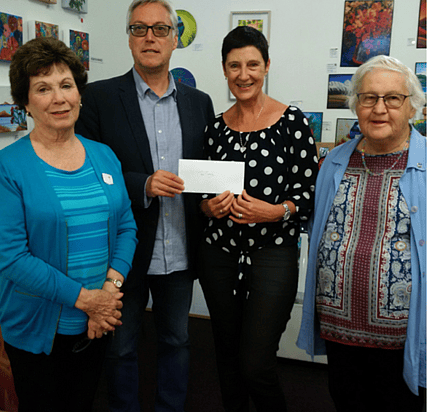 Receiving donation for $2,000.00 to support their services.