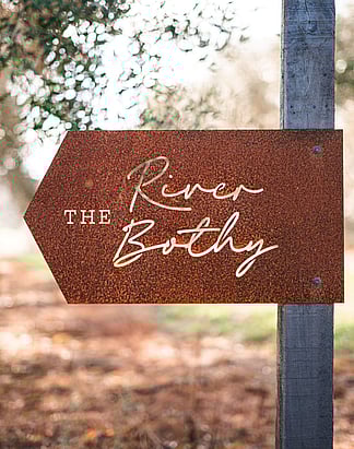 Unwind in Northland accommodation | Tucked in an olive grove, relax in a hammock outdoors