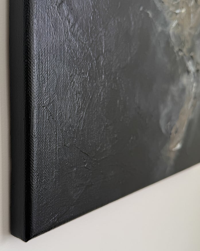 Side left view of canvas with smooth dark brown painted edge, subtle surface texture and centralised impasto visible toward the outer right edge