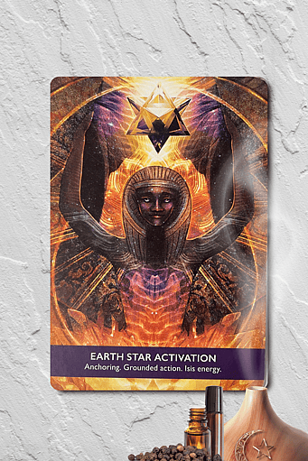 Earth Star Activation Card from the Gateway of Light Activation Deck by Kyle Gray with essential oil bottles a diffuser and black peppercorns symbolising how you can work with Black Pepper and the Earth Star