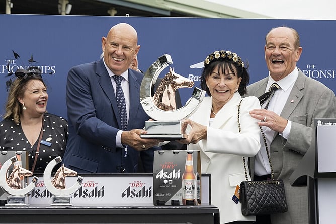 Sir Brendan Lindsay (right) and Lady Jo Lindsay pictured accepting the trophy following Joliestar's victory in the Gr.1 T J Smith Stakes (1200m). - Photo: Bradleyphotos.com.au