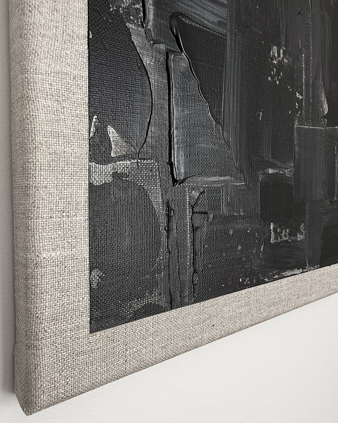 black and pale cream acrylic on linen, impasto edge over raw linen margin, vertical drag marks, matte field, visible weave