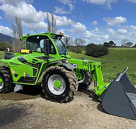 Merlo telehandler working in a Waikato farm paddock with a bucket attachment