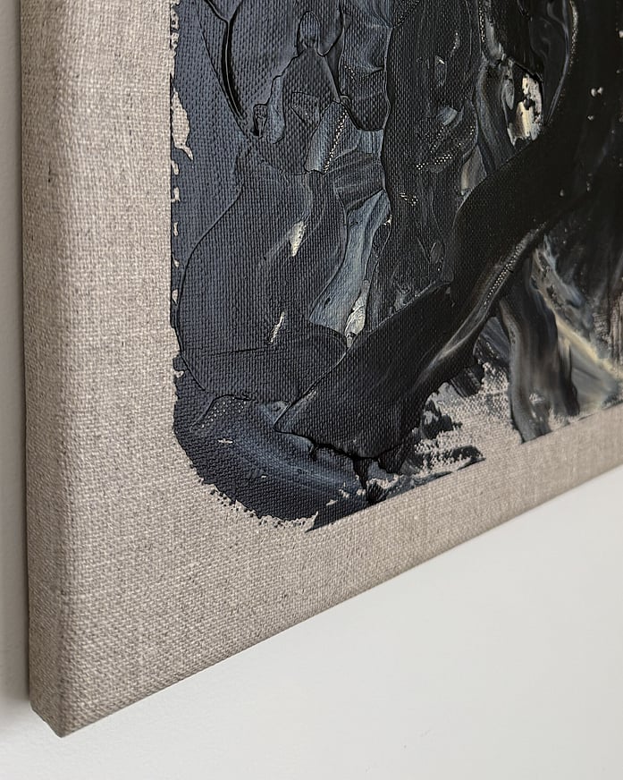 black and pale cream acrylic on linen, impasto buildup at edge over raw linen, dragged paint marks, matte field, exposed weave