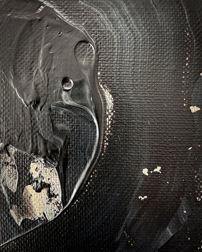 black and pale cream acrylic on linen, impasto ridge with pooled edge, small air bubbles, glossy surface, visible linen weave